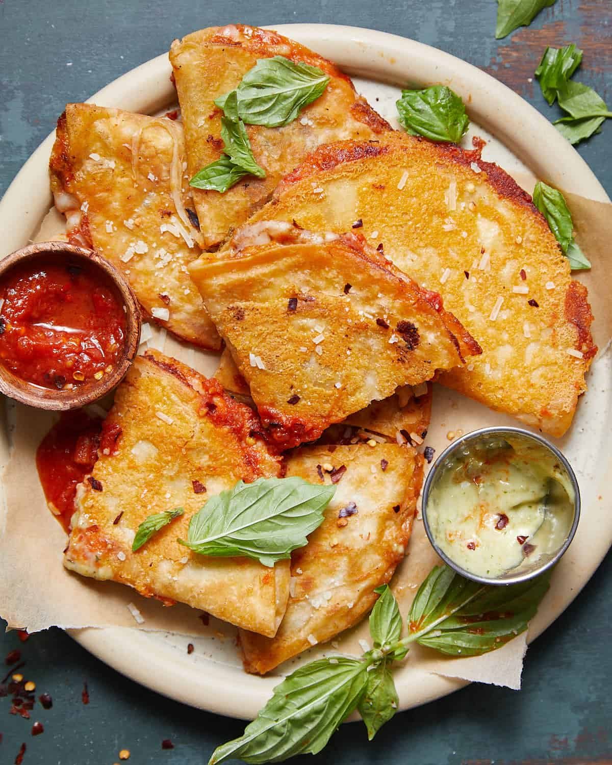 Overhead image of pizza tortilla wrap with garnish.