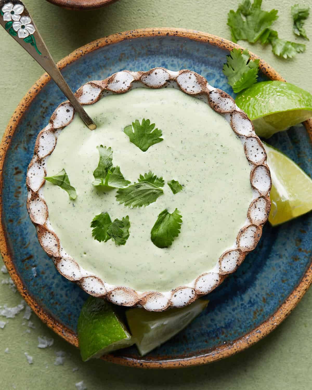 Overhead image of poblano sauce with garnish.