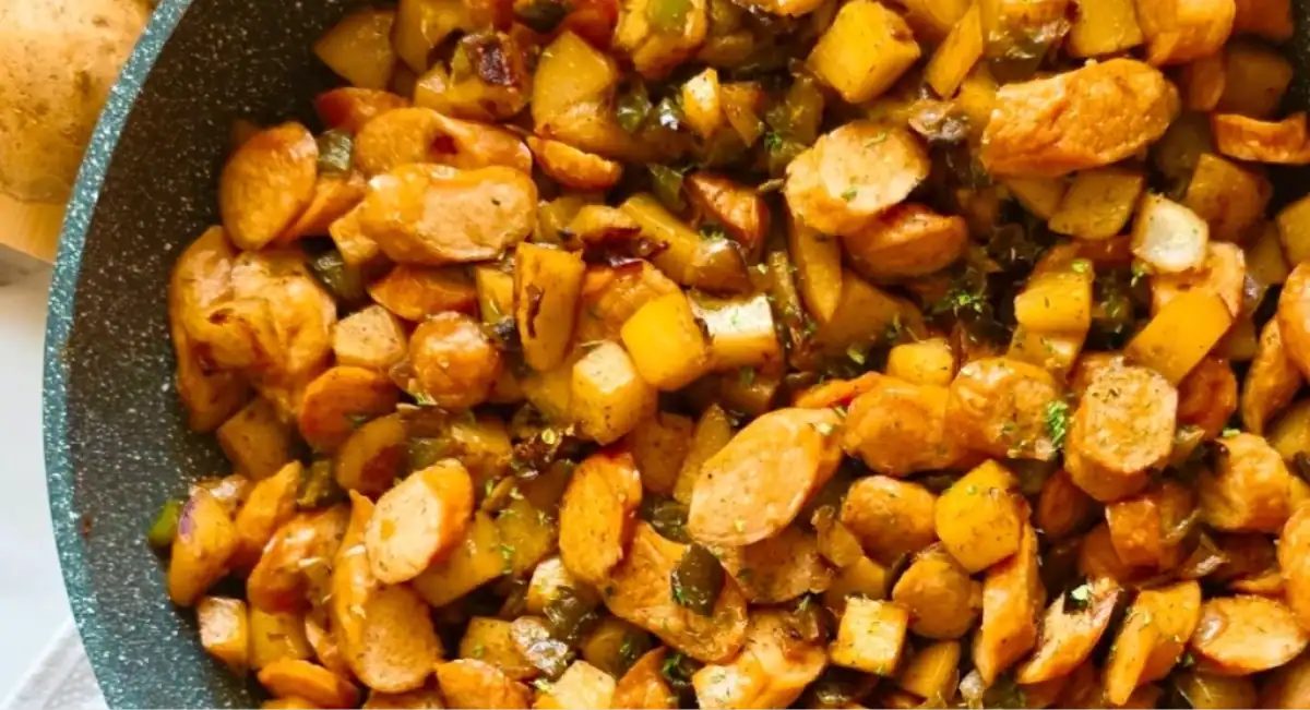 Overhead image of potato sausage recipe in green dish.