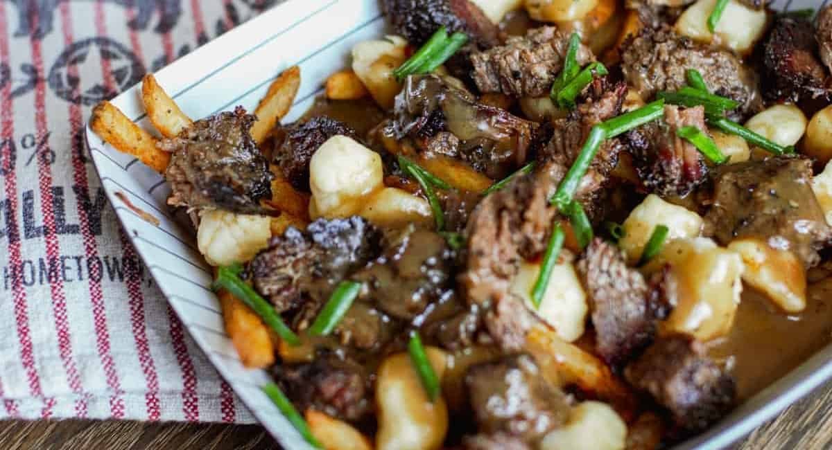 Overhead image of bbq poutine with smoked brisket.