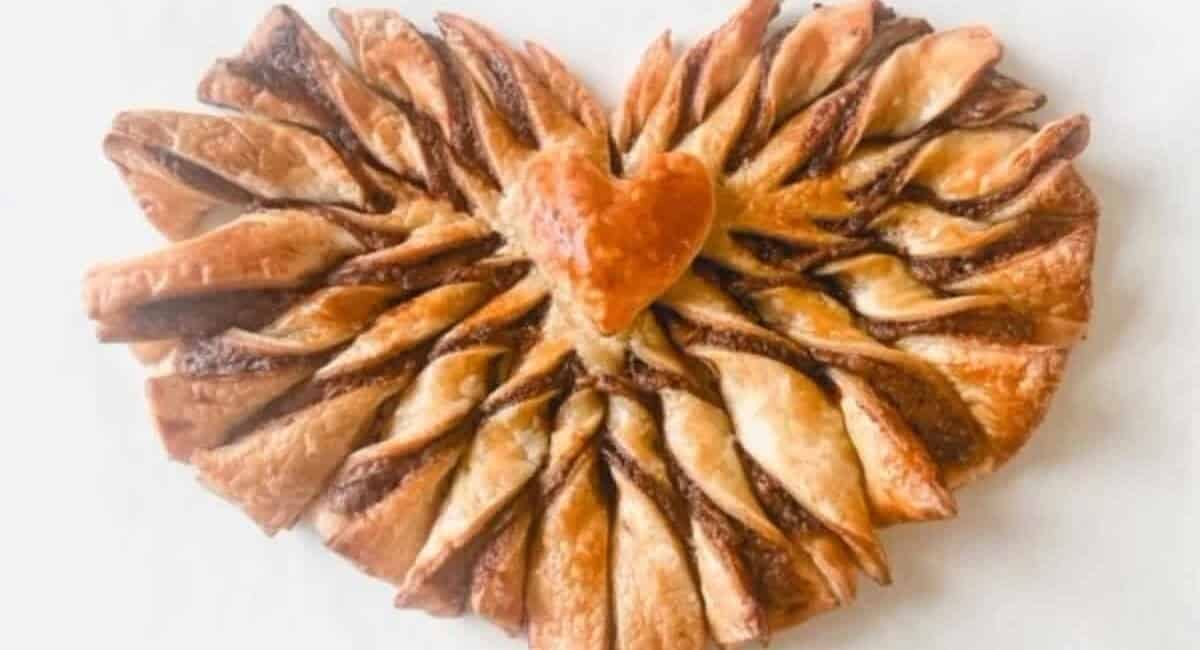 Overhead image of Nutella puff pastry heart-shaped twists.