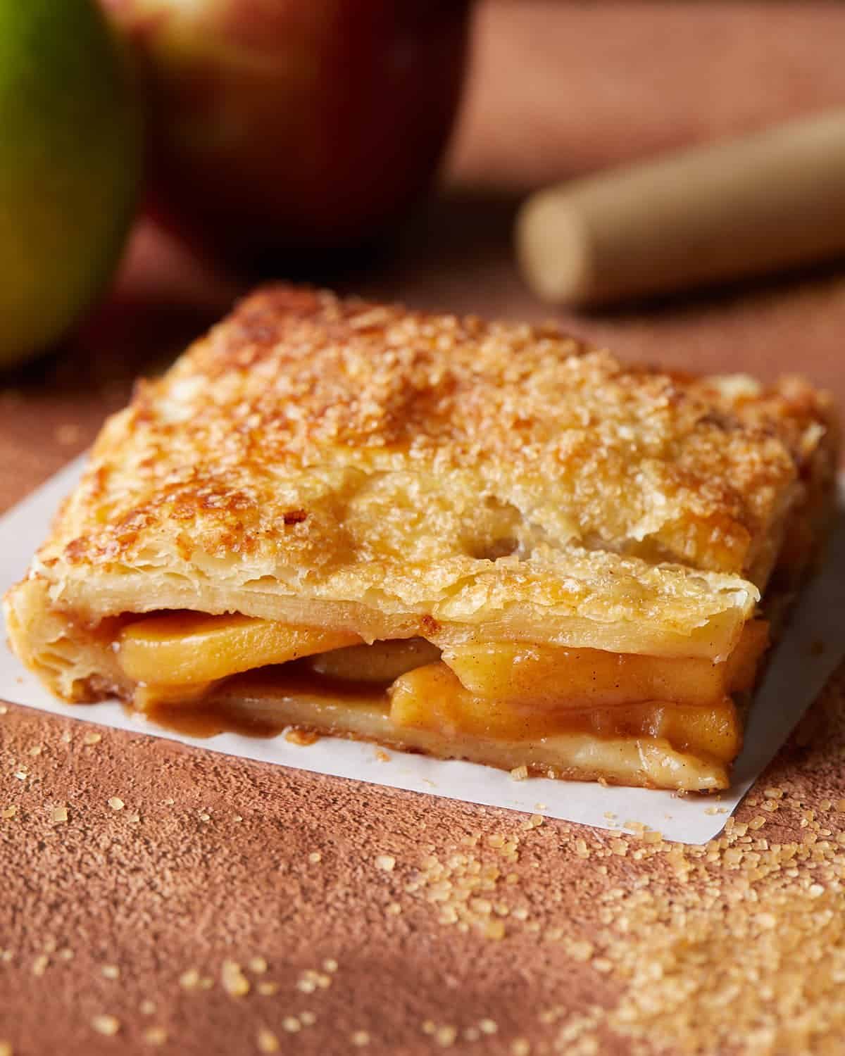 Up close image of puff pastry apple pie (slab style).