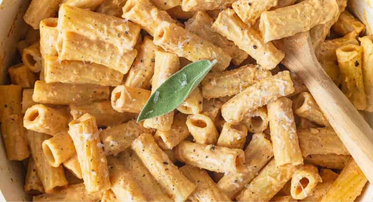 Overhead image of pumpkin alredo pasta with garnish.