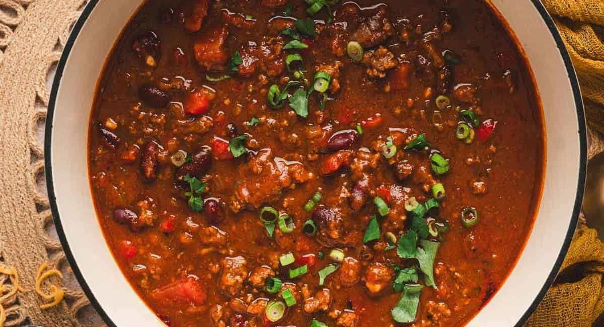 Overhead image of pumpkin chili with garnish.