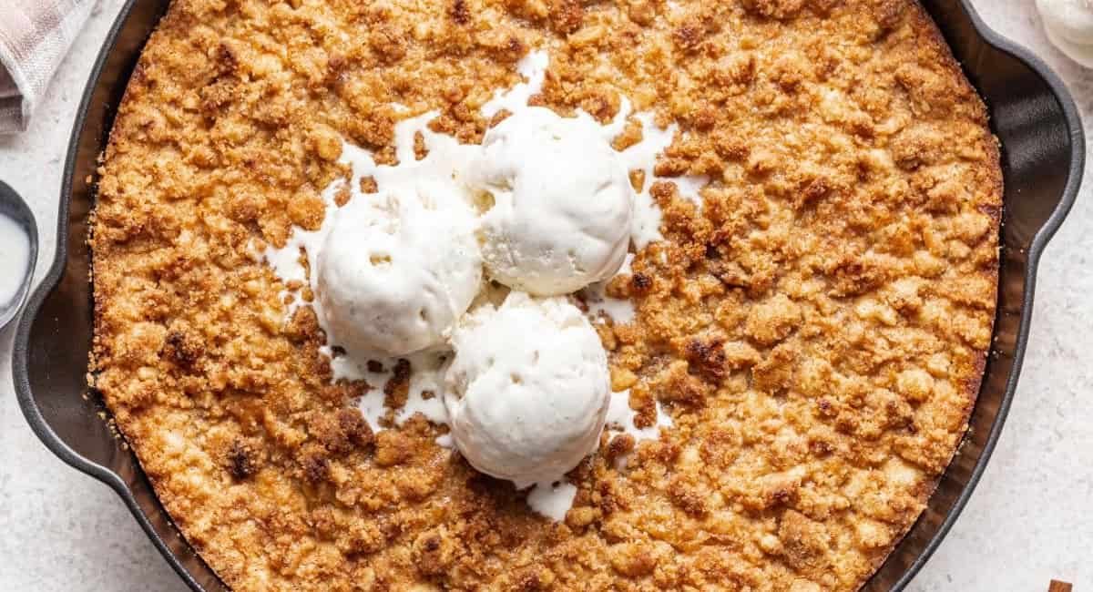 Overhead image of pumpkin crispy with ice cream topping.