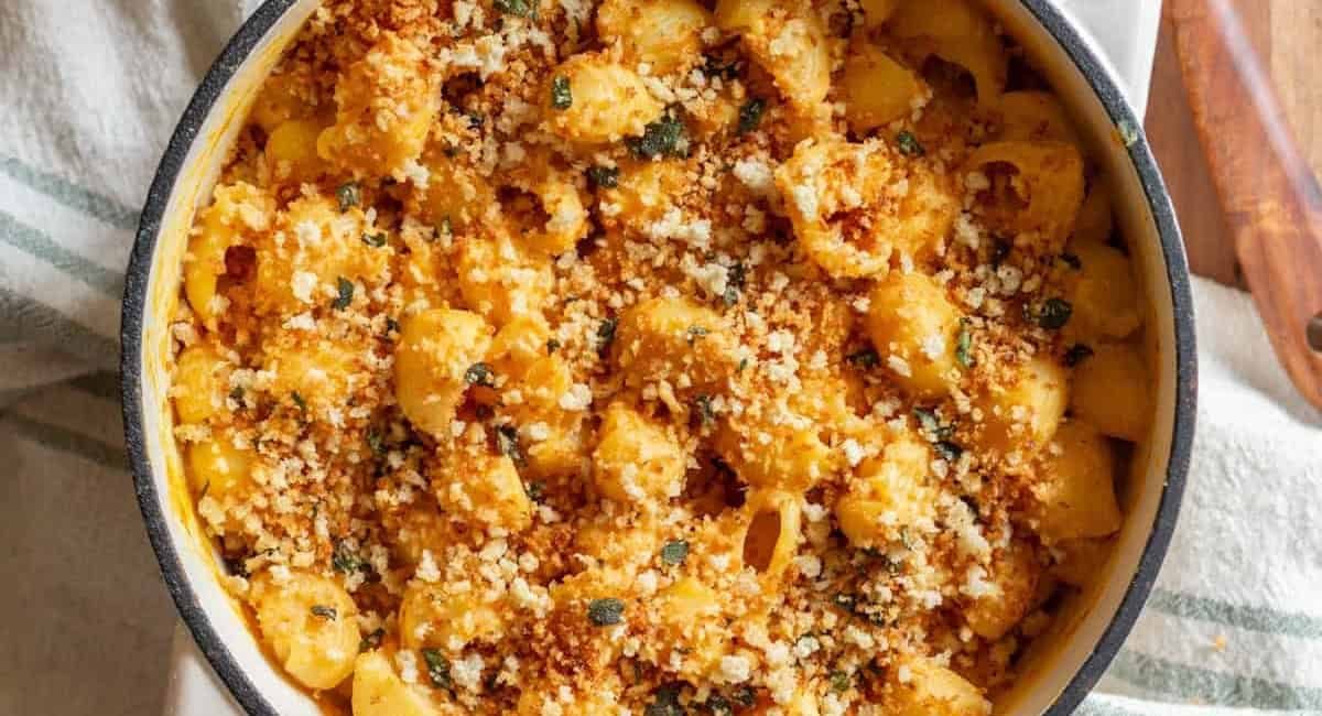 Overhead image of pumpkin ricotta mac and cheese with garnish.