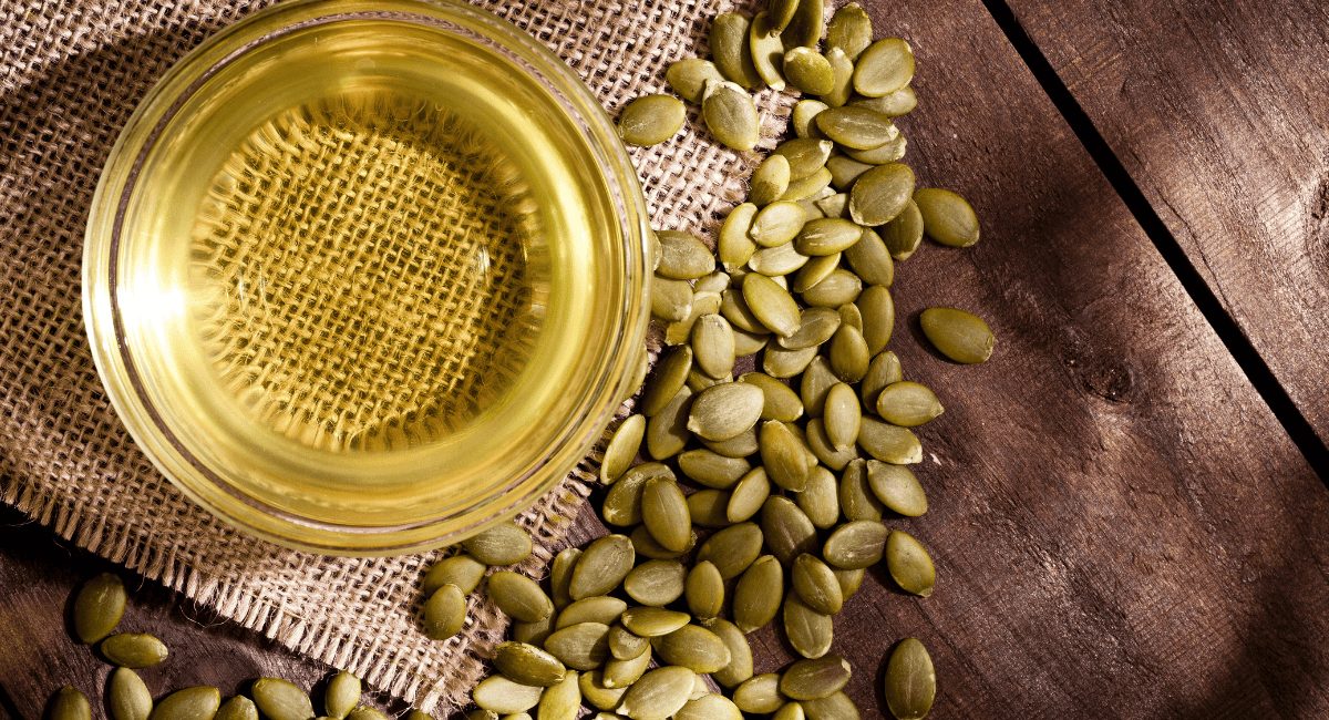 Overhead image of pumpkin seed oil.