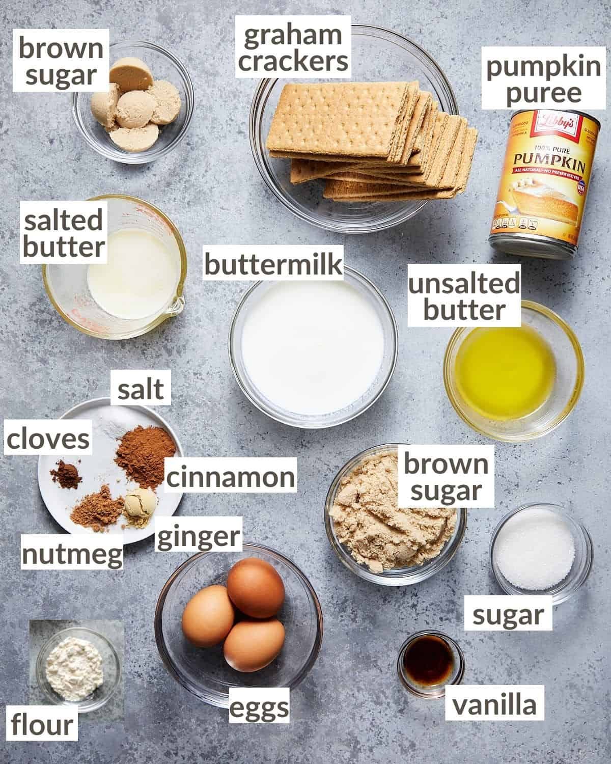 Ingredients in glass bowls needed to make a graham cracker crust pumpkin pie.