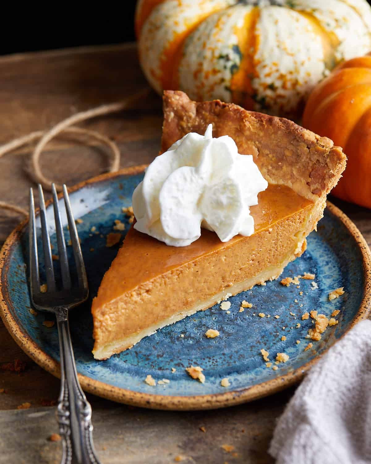 Side profile of pumpkin pie with sweetened condensed milk.