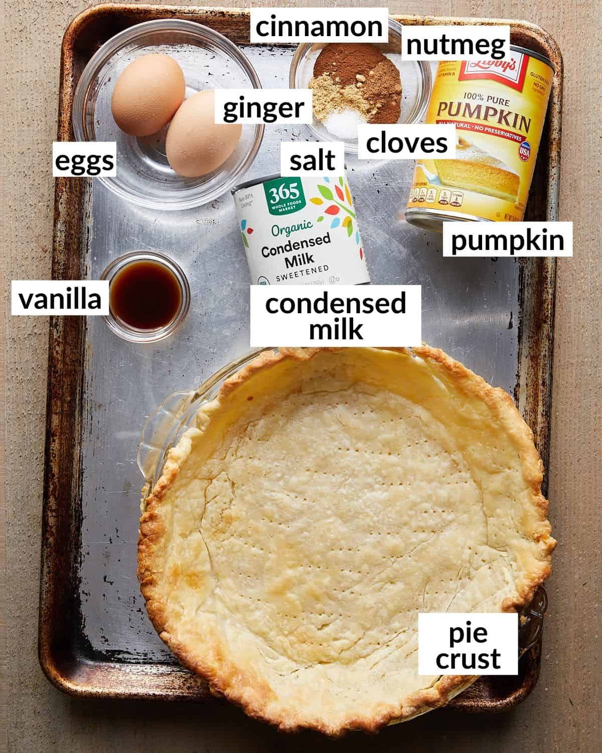 Overhead image of ingredients needed to make pumpkin pie with sweetened condensed milk.