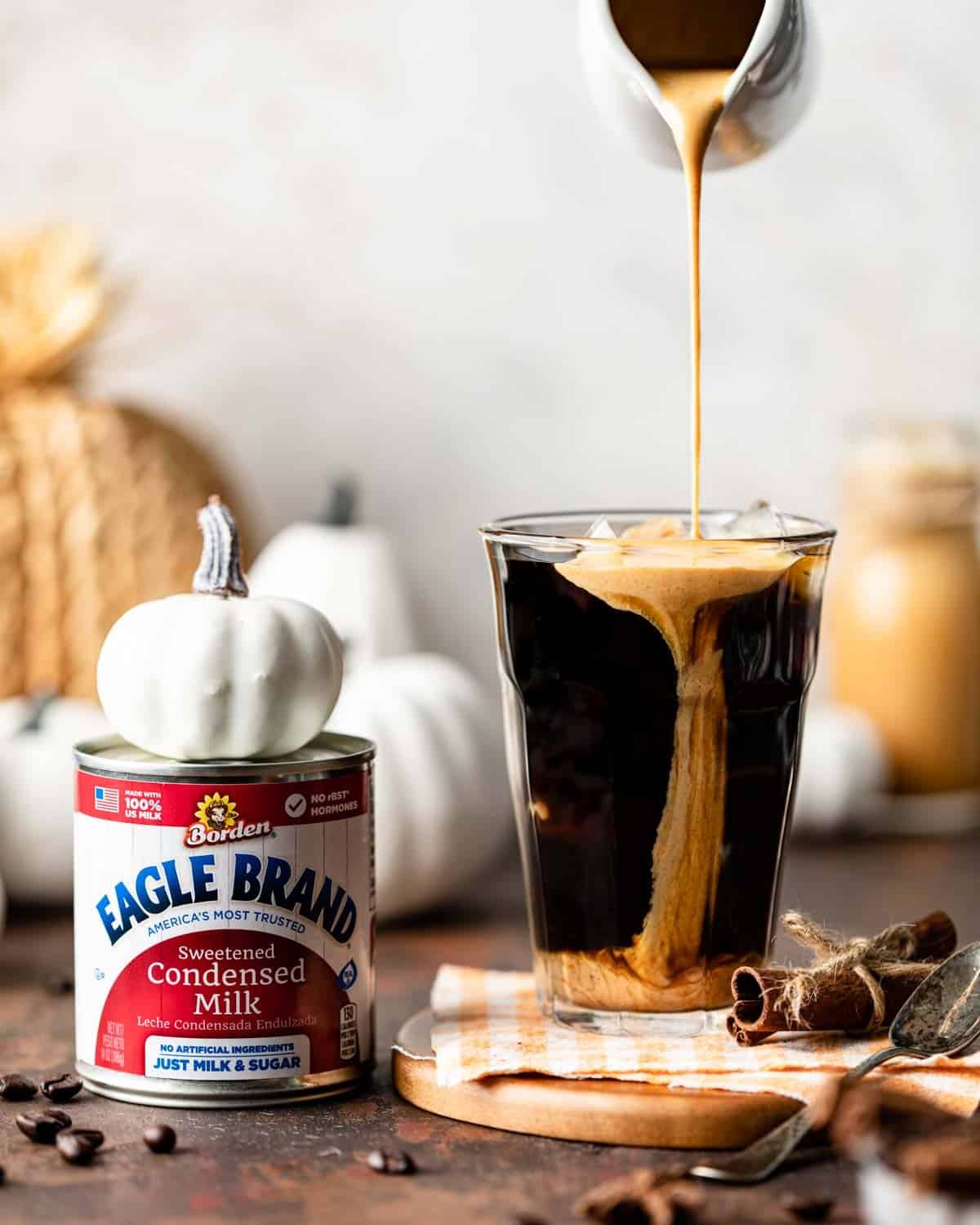 cream being poured into cold brew