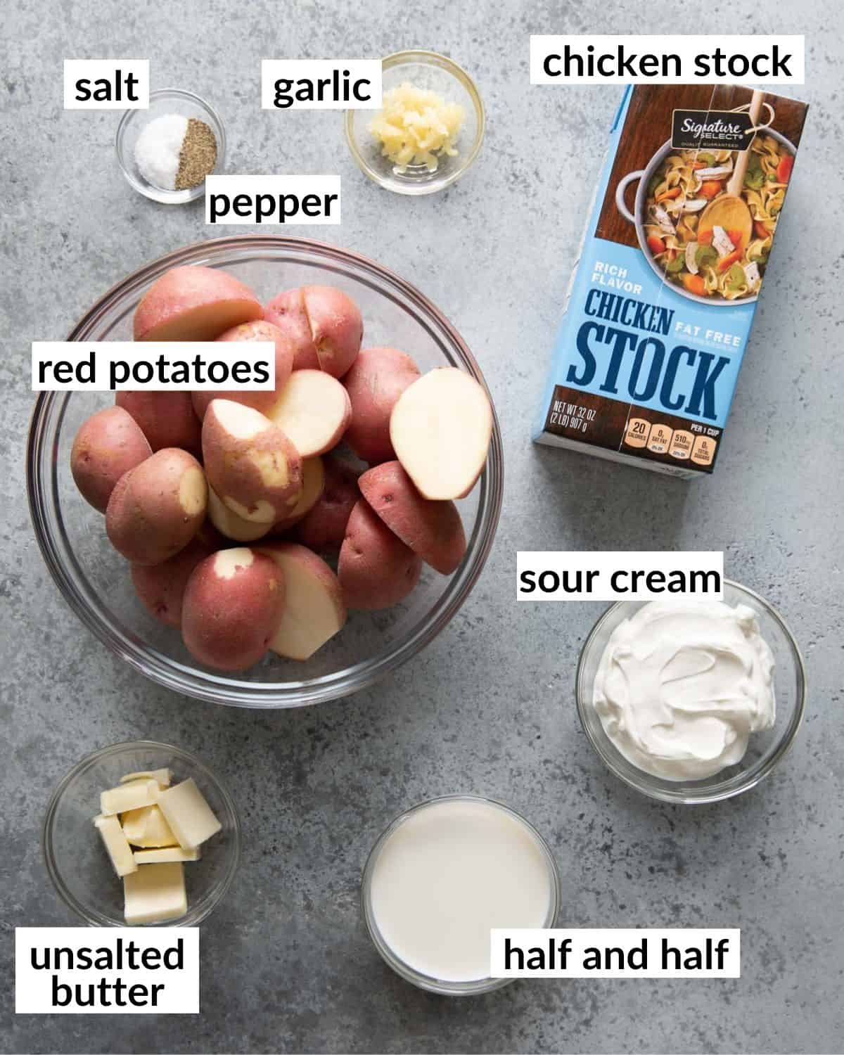 Ingredients needed to make red skin mashed potatoes in glass bowls.