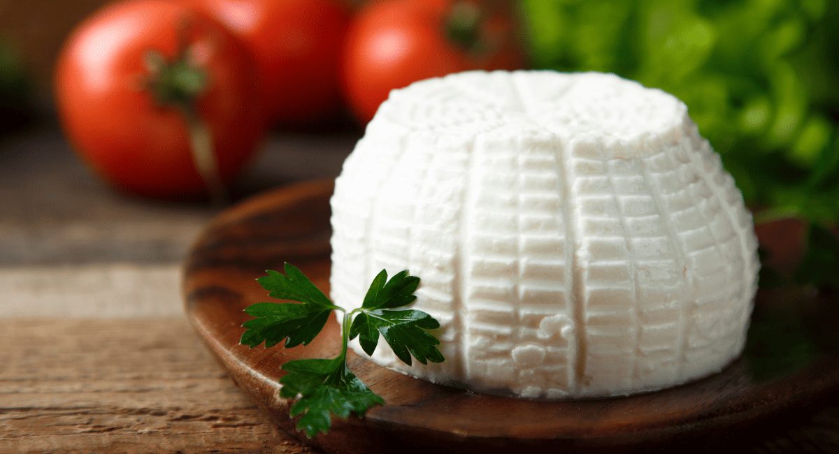 Up close photo of ricotta cheese.