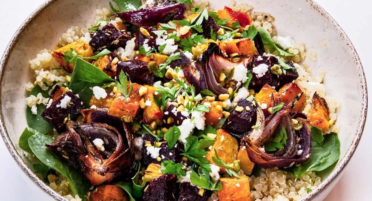 Overhead image of roasted beet pumpkin salad with feta and pistachios.