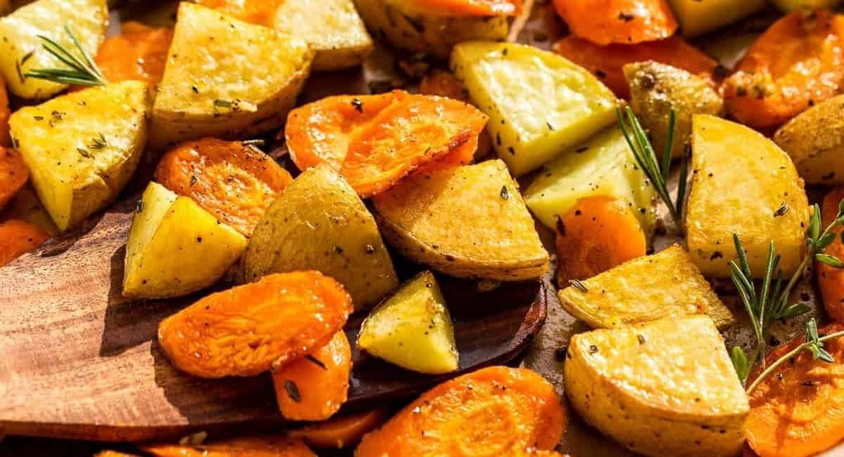 Up close image of roasted potatoes and carrots.