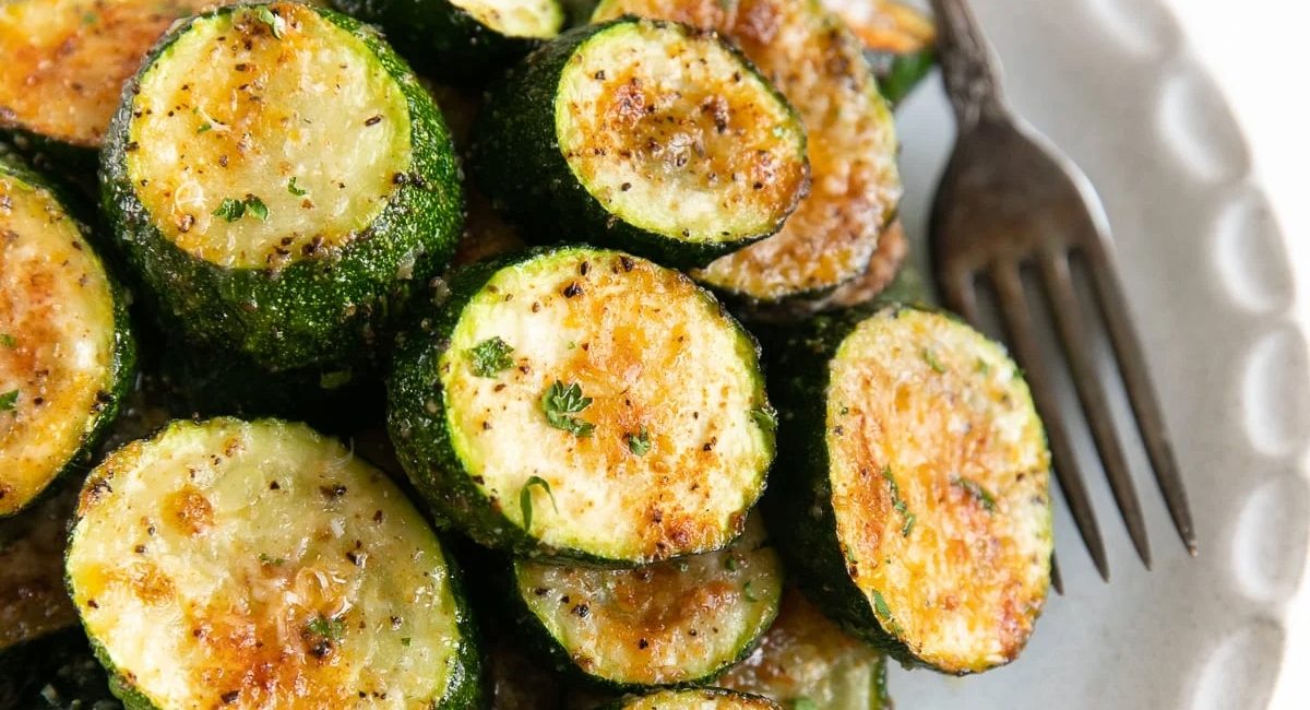 Overhead image of roasted zucchini with parmesan.