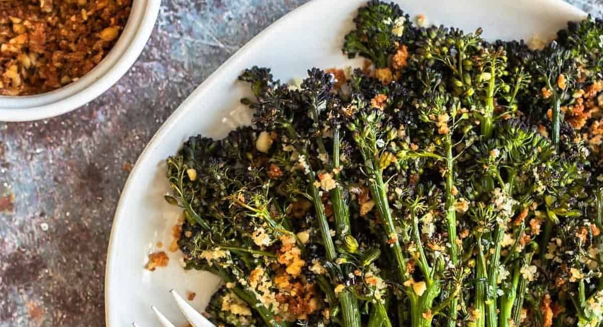 Overhead image of roasted broccolini with parmesan-pine nut pangritata.
