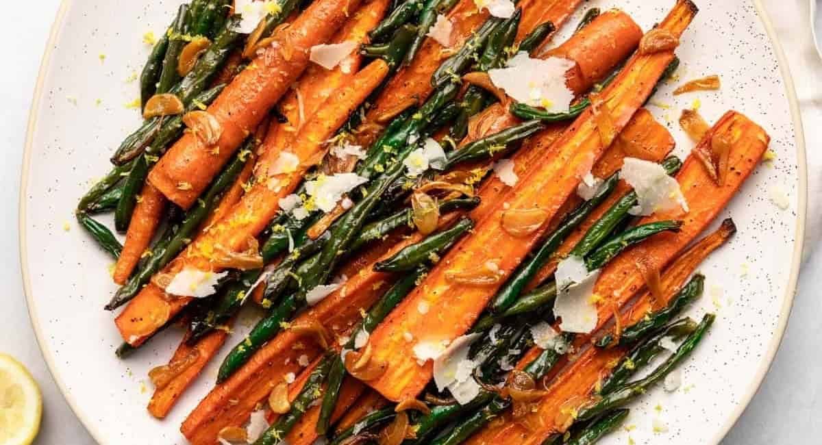 Overhead image of roasted green beans and carrots.