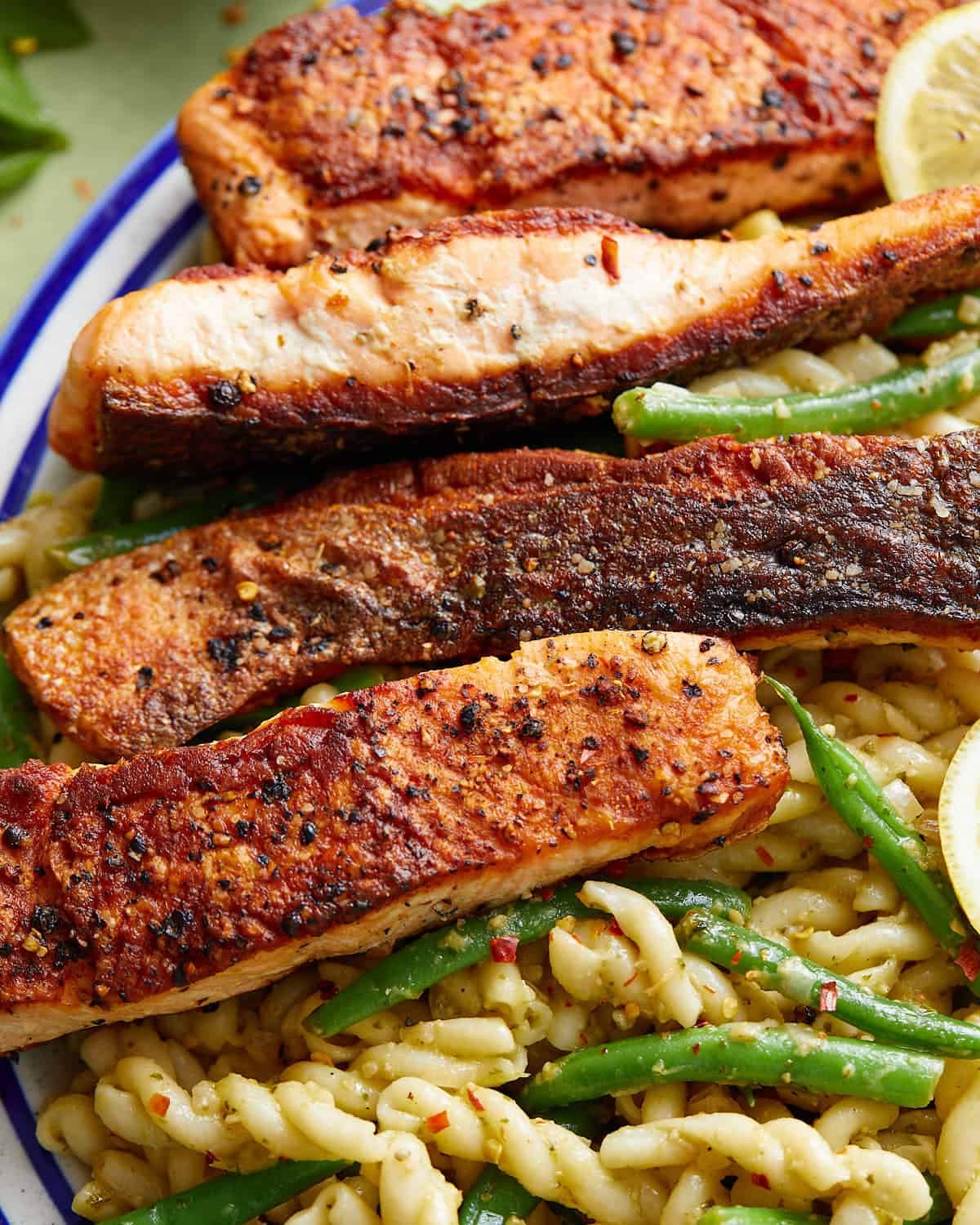 Up close image of salmon pasta without cream sauce.