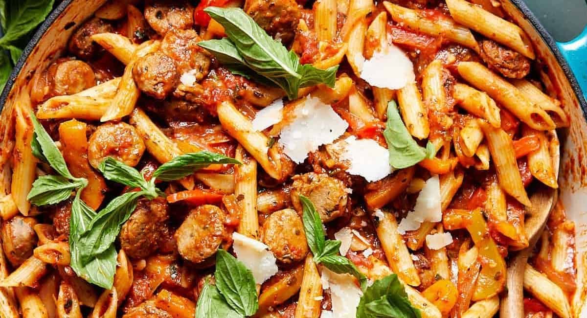 Overhead image of sausage and peppers pasta.