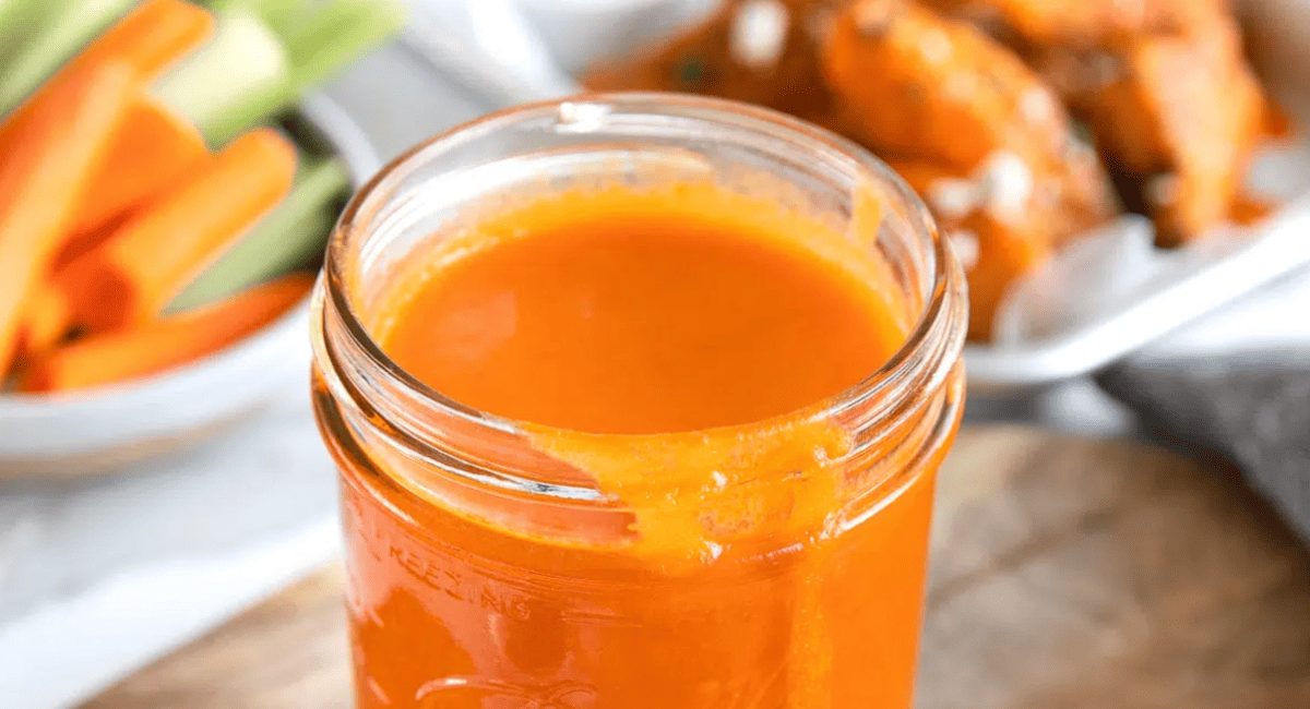 Up close image of spicy buffalo sauce.