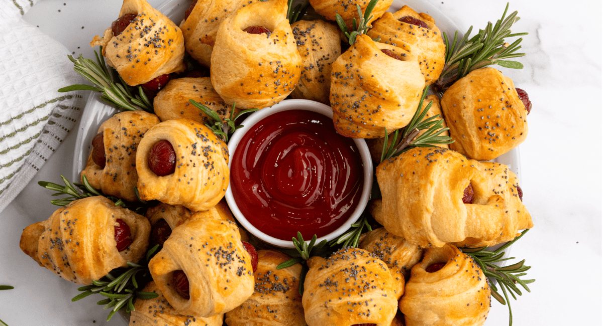 Overhead image of pigs in a blanket with puff pastry.