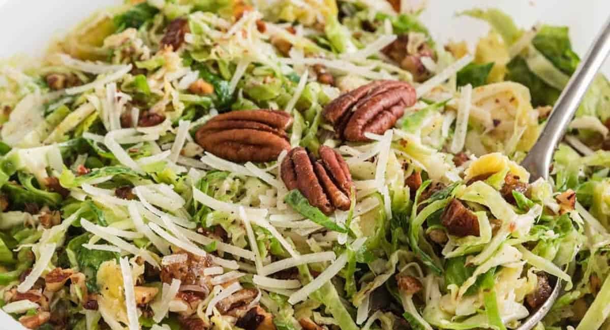 Up close image of shaved brussels sprouts and parmesan salad.