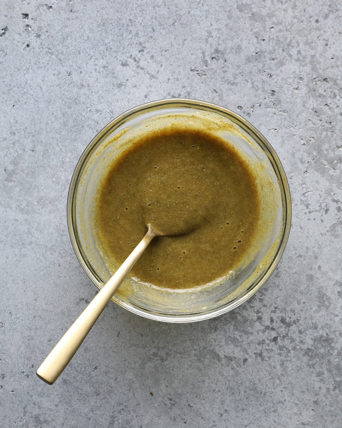 Maple Dijon seasoning mixture stirred together in a glass bowl.