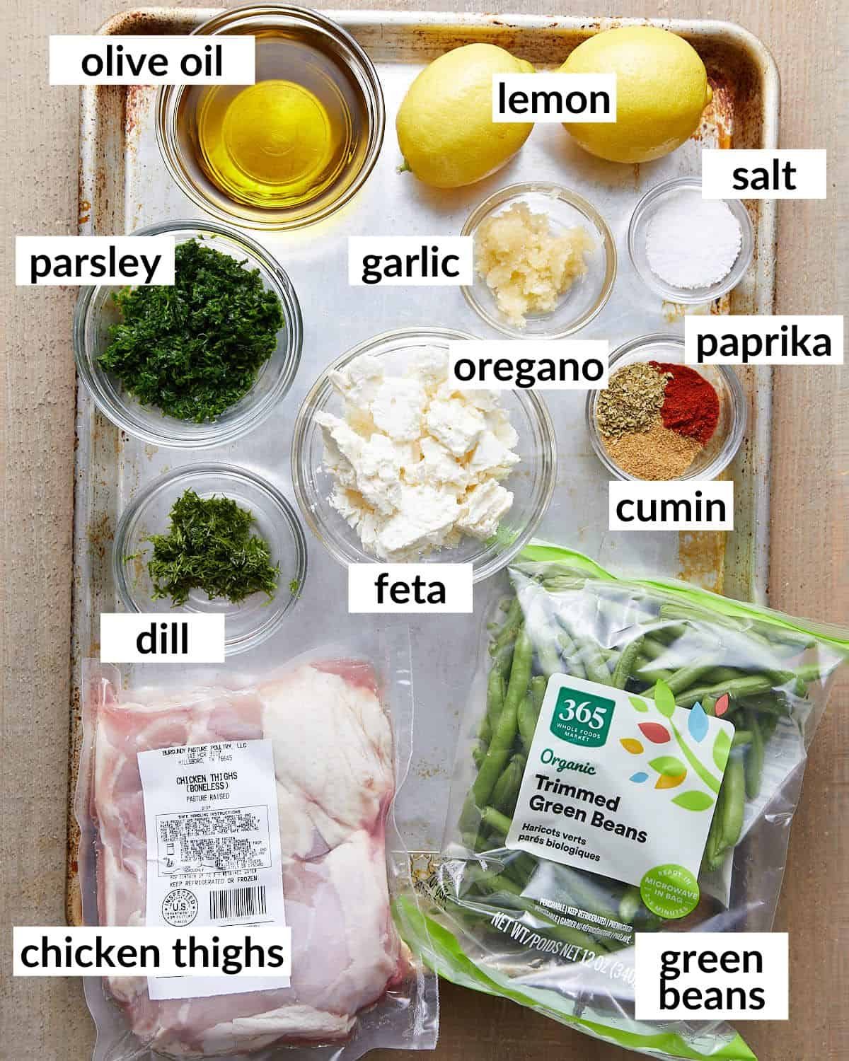 Overhead image of ingredients needed to make sheet pan chicken and green beans.