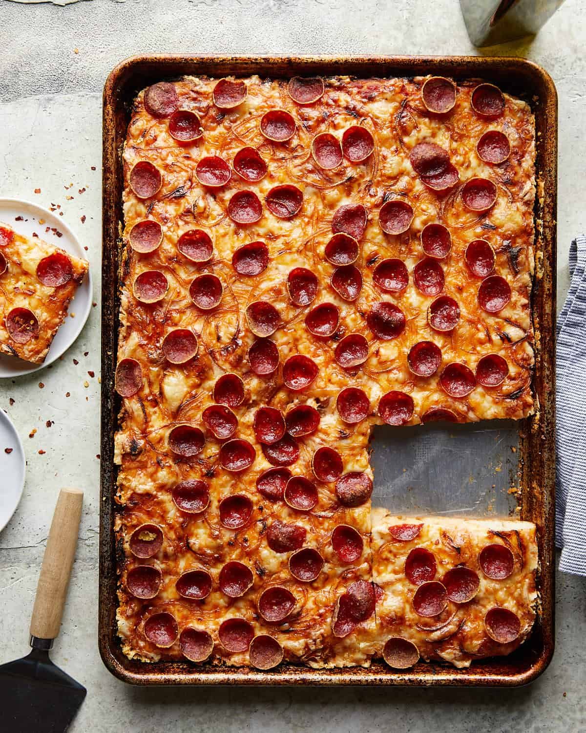 Overhead image of crispy pepperoni sheet pan pizza.
