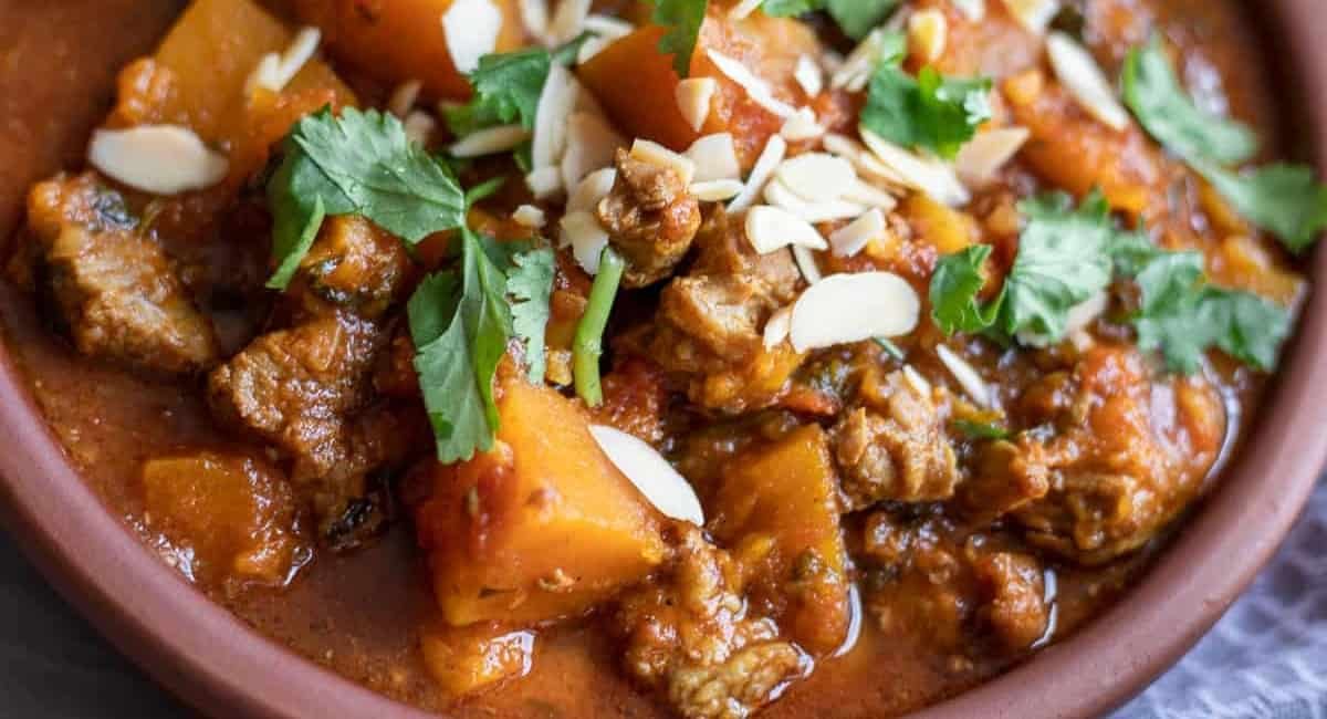 Overhead image of slow cooked lamb tagine with apricots.