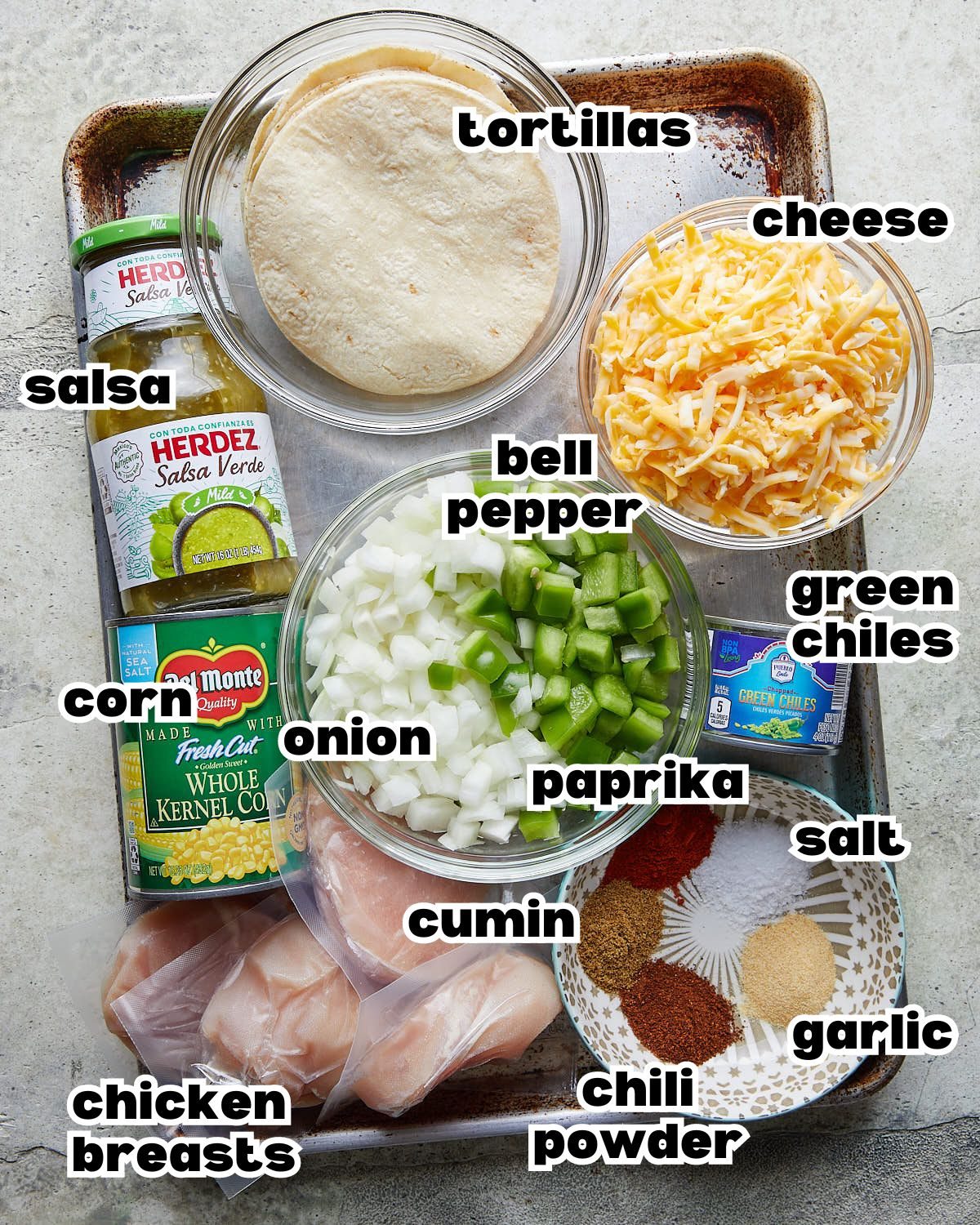 Overhead image of ingredients needed to make slow cooker chicken enchilada casserole.