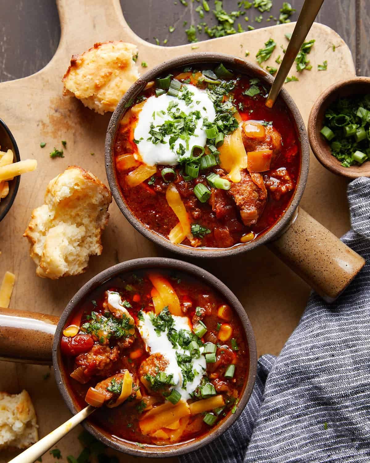 Overhead image of slow cooker no bean chili with garnish.