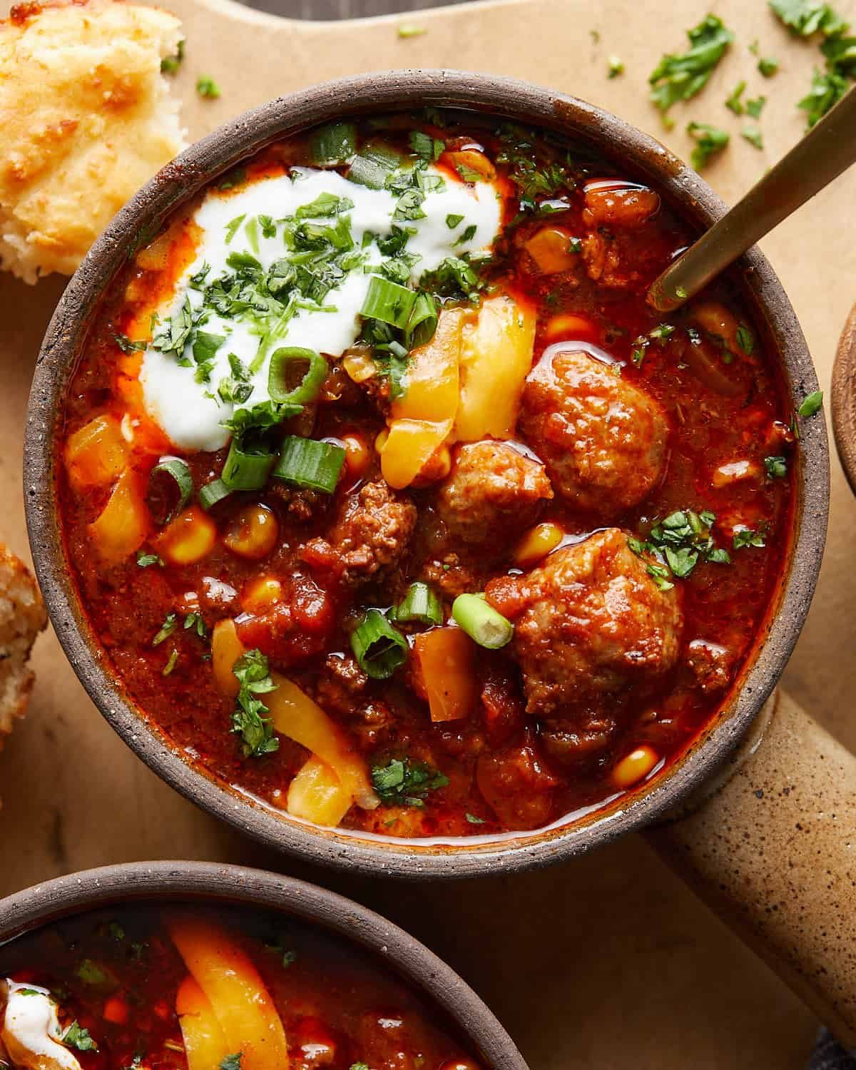 Up close overhead image of slow cooker no bean chili with garnish.