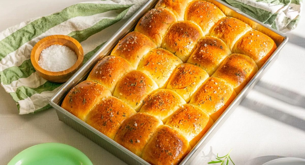 Overhead image of sourdough dinner rolls with rosemary.