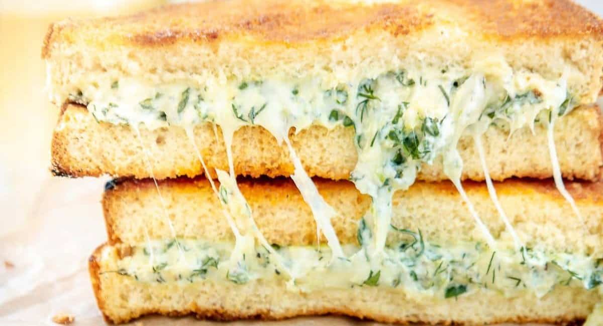 Up close image of greek spanakopita grilled cheese sandwich.