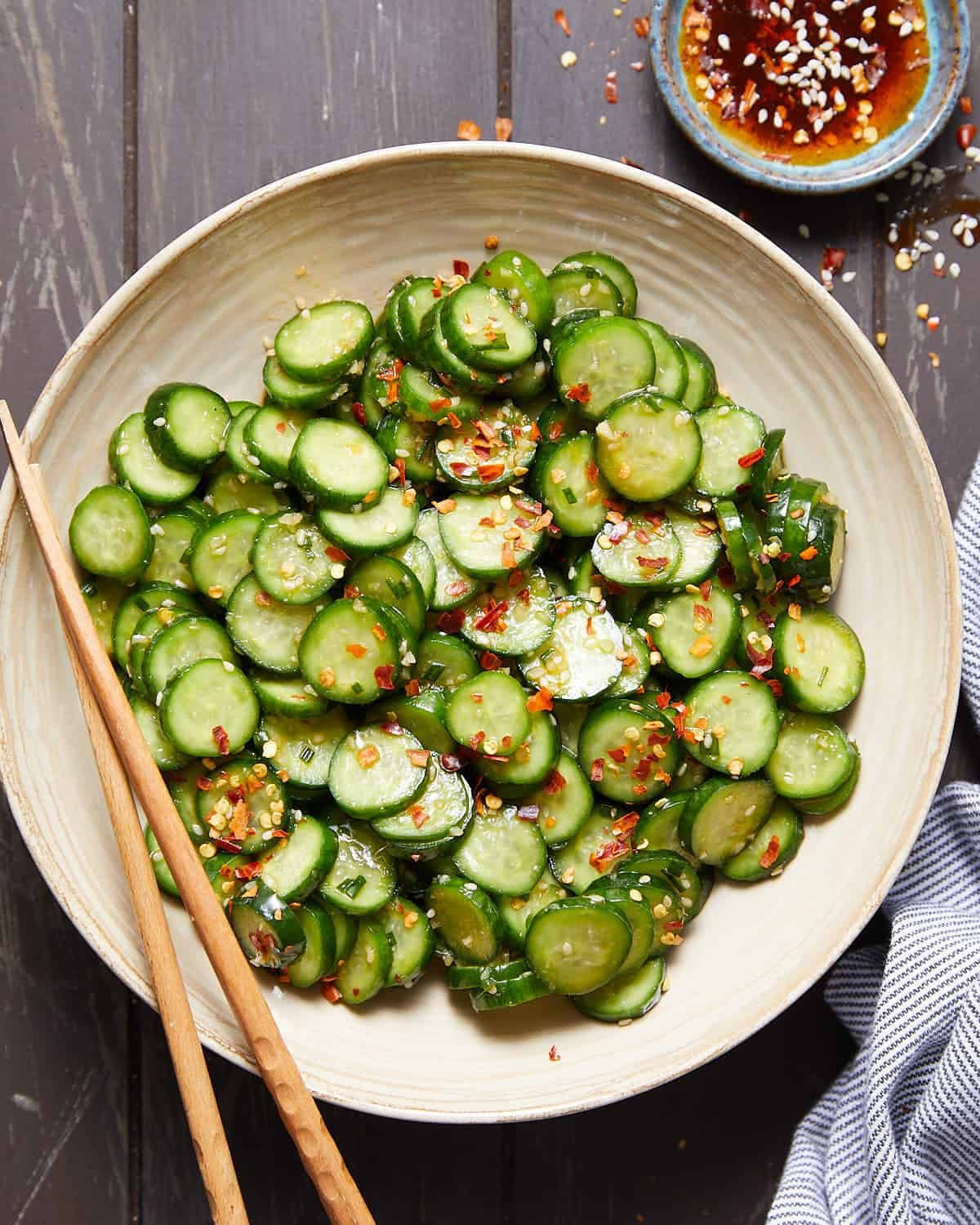 Overhead image of spicy cucumber salad with garnish.