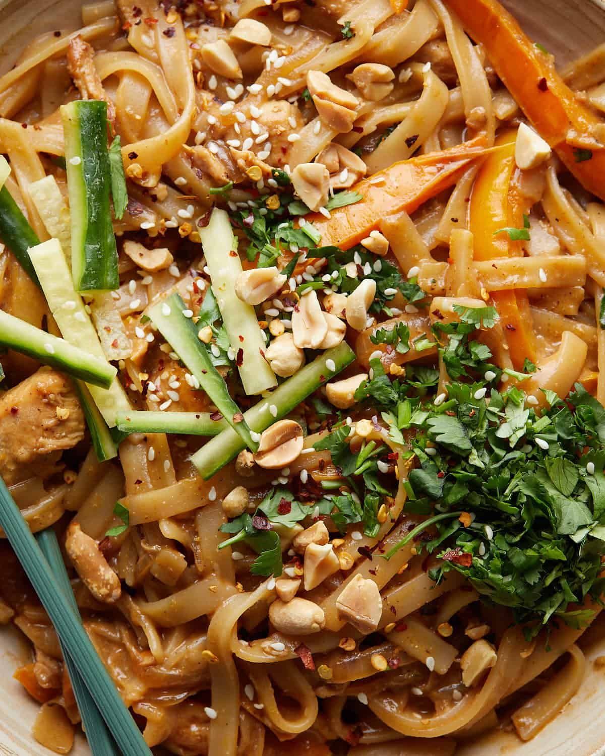 Up close image of spicy peanut noodles with chicken.