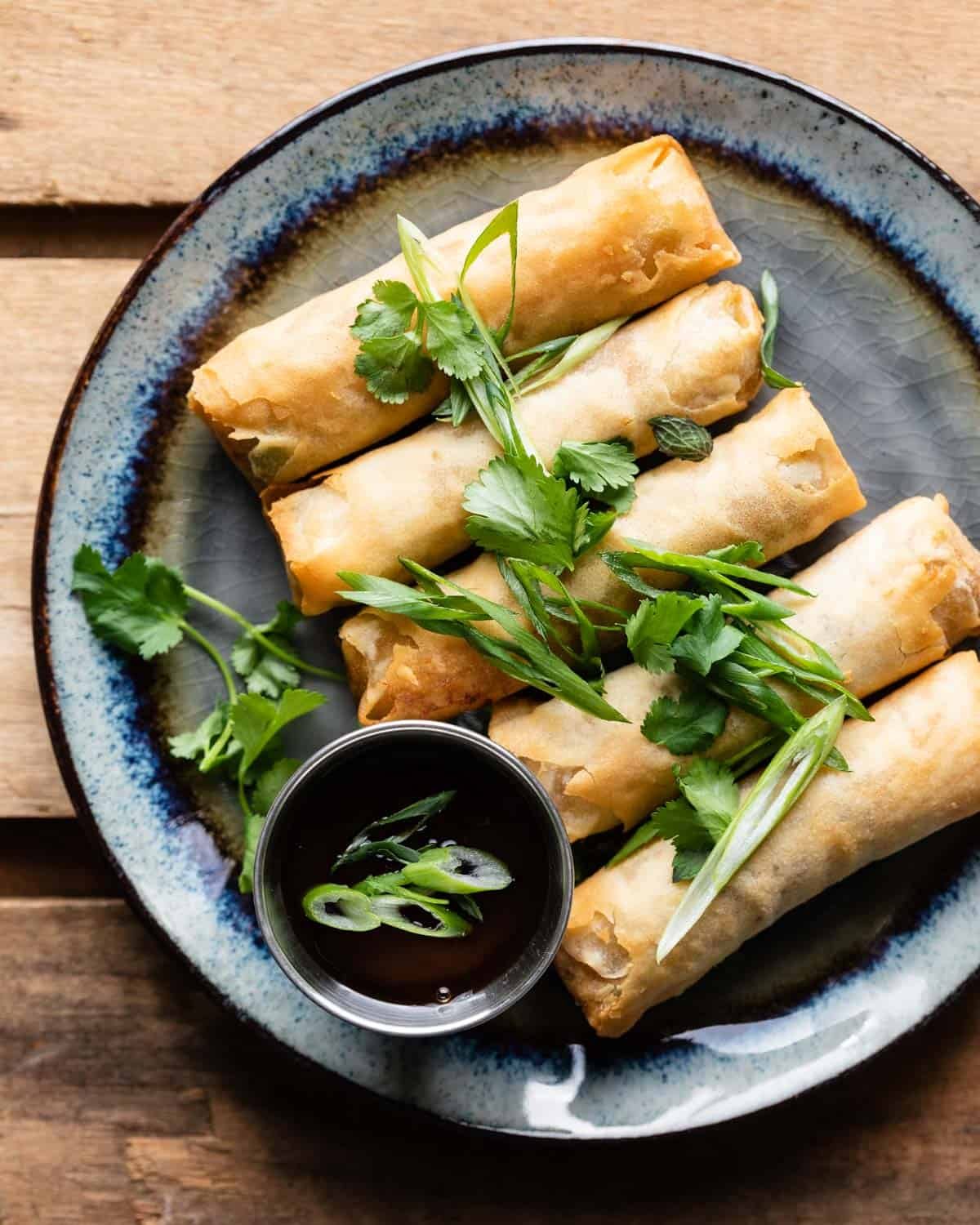 Overhead image of air fryer frozen spring rolls.