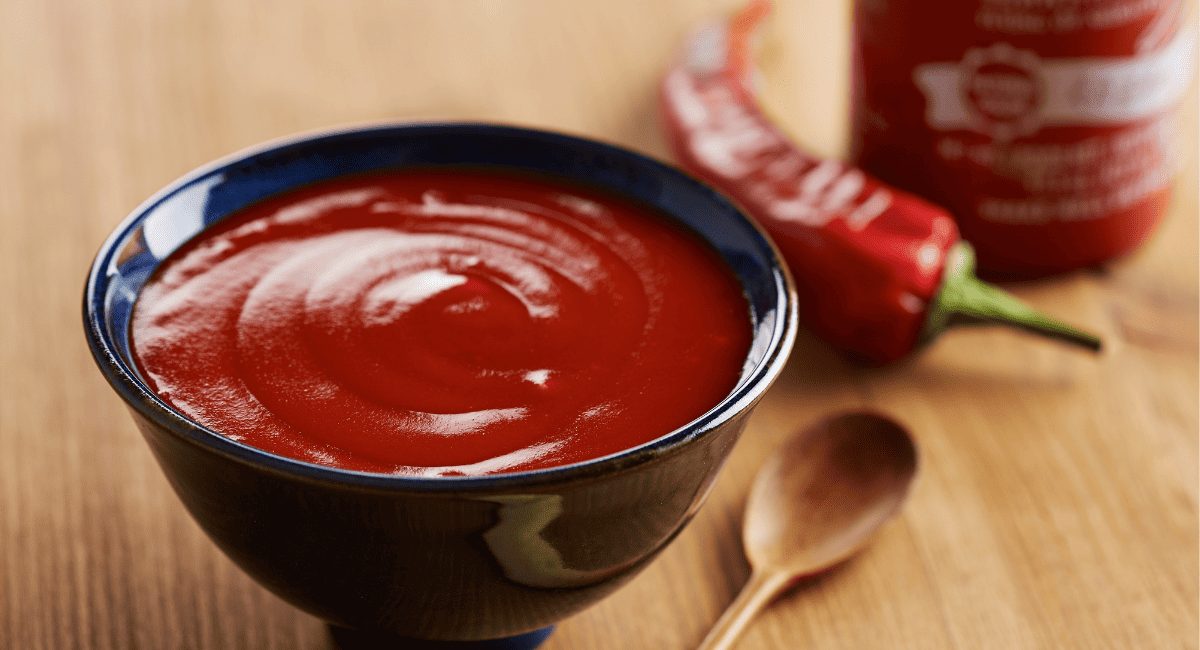 Overhead image of sriracha sauce.
