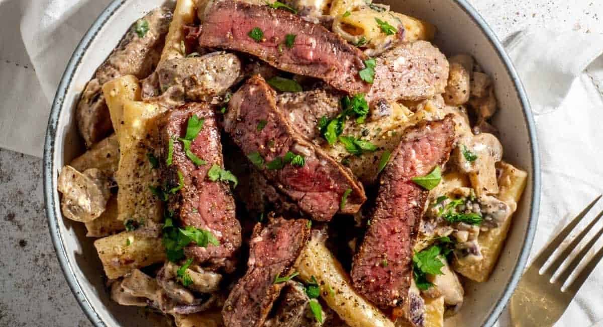 Overhead image of creamy steak pasta recipe.