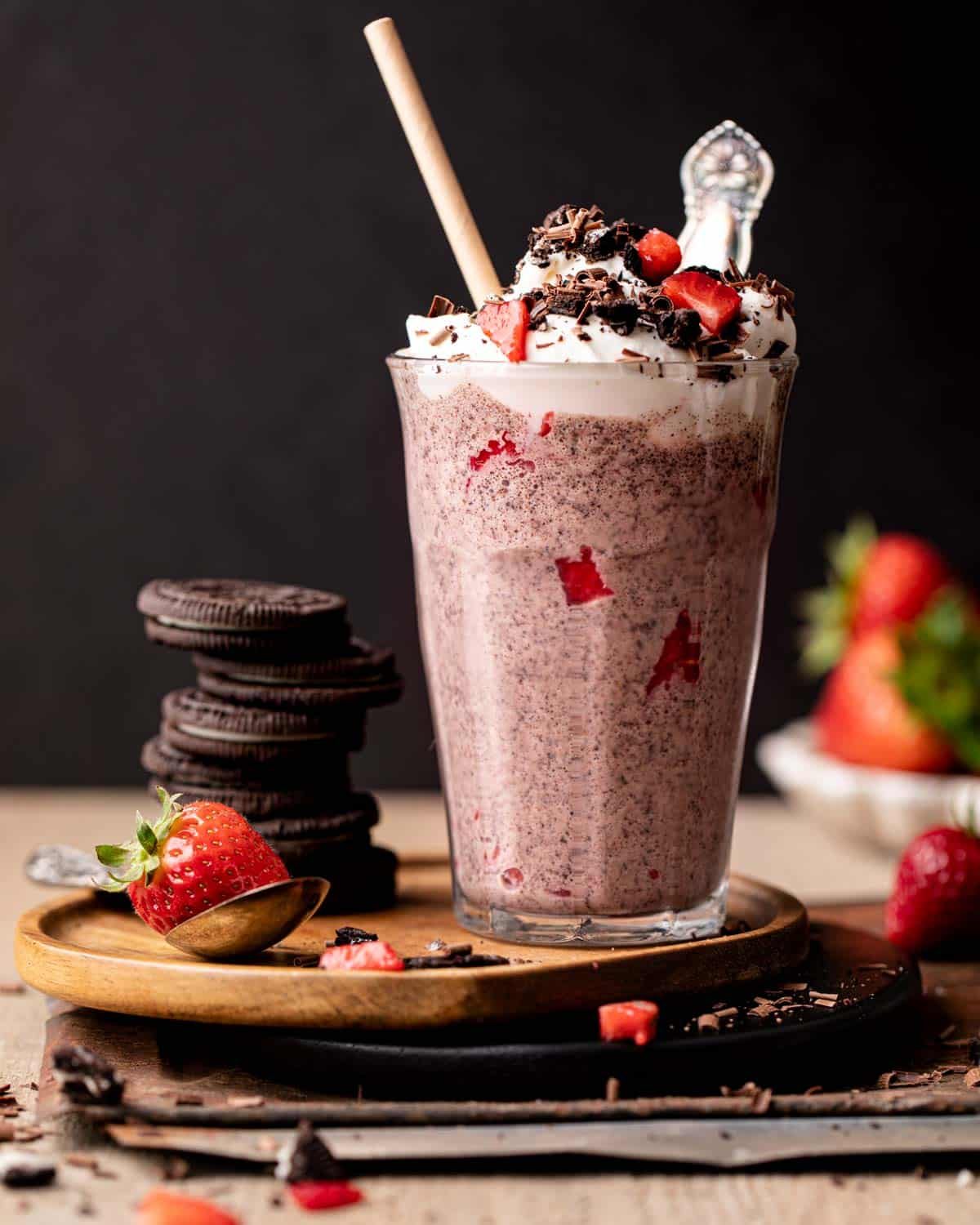 side shot of milkshake in a glass with whipped cream