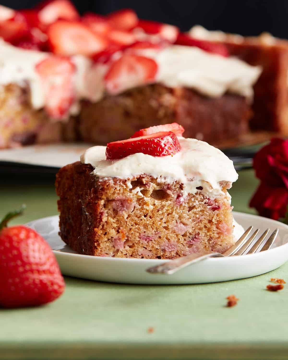 Up close image of strawberry snack cake on white dish.