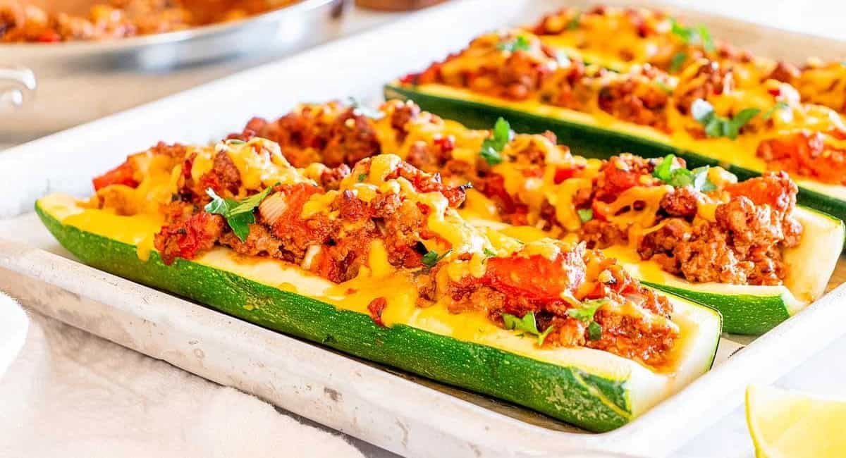 Side profile image of taco stuffed zucchini boats.