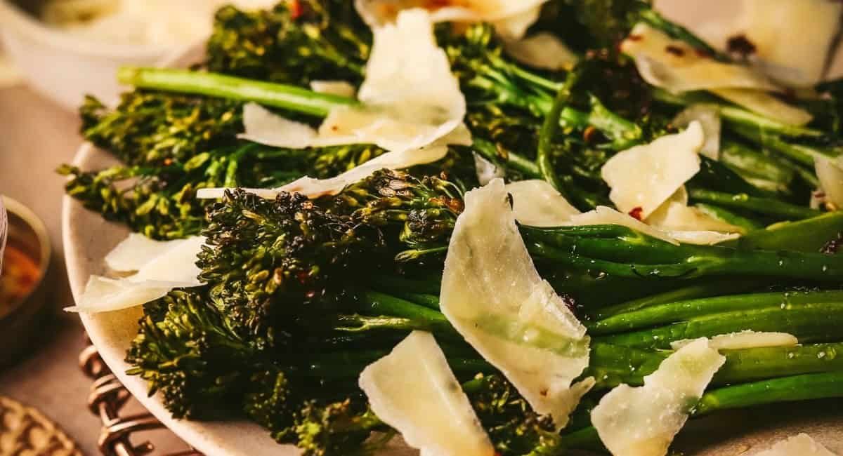 Up close image of roasted tenderstem broccoli with honey and parmesan.