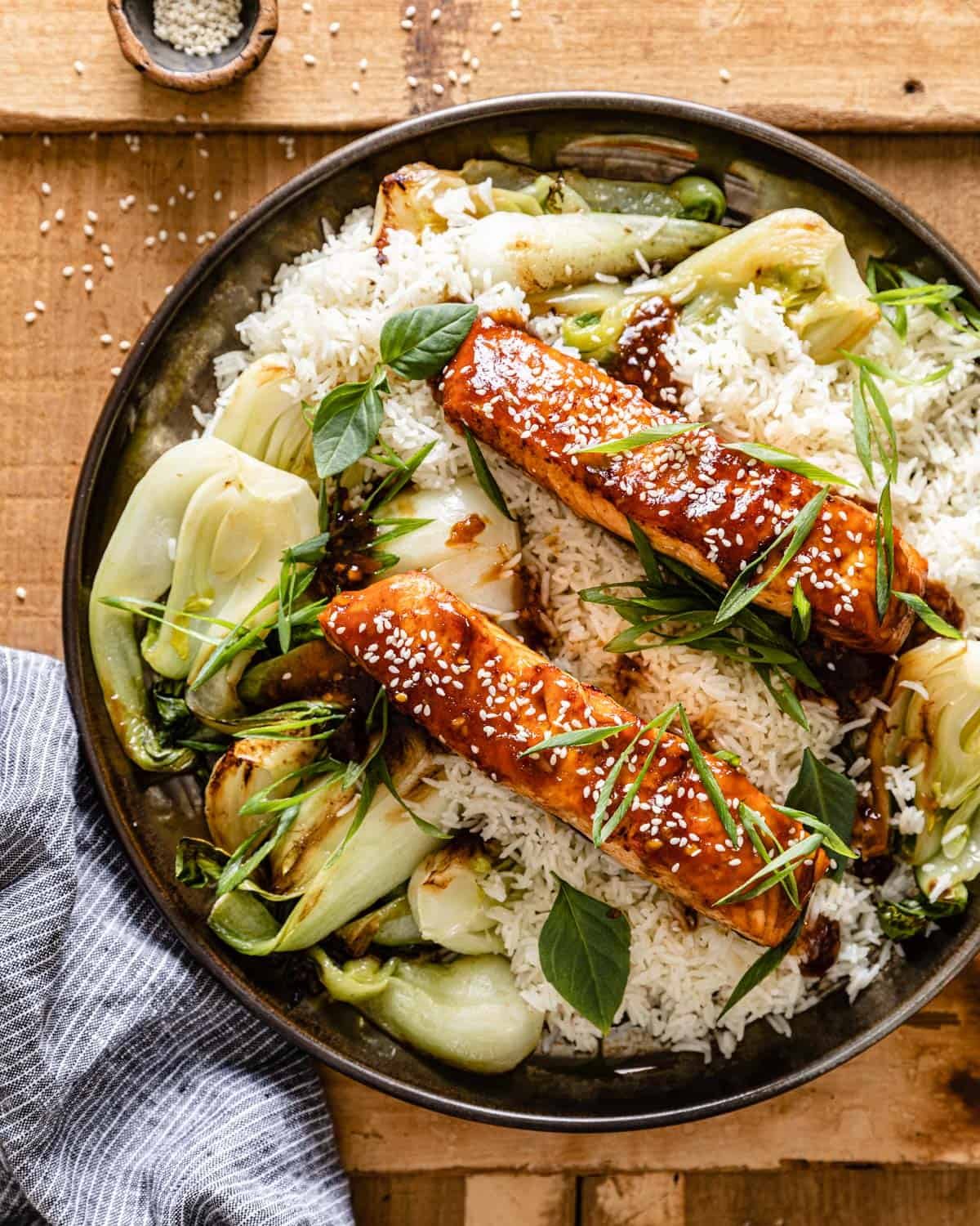 overhead of teriyaki salmon air fryer over rice and bok choy