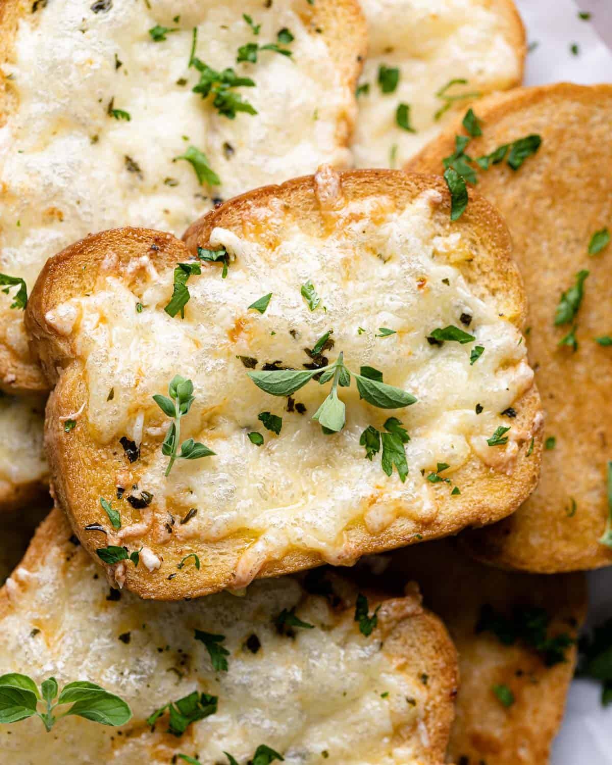 Texas toast garlic bread with herbs on top.