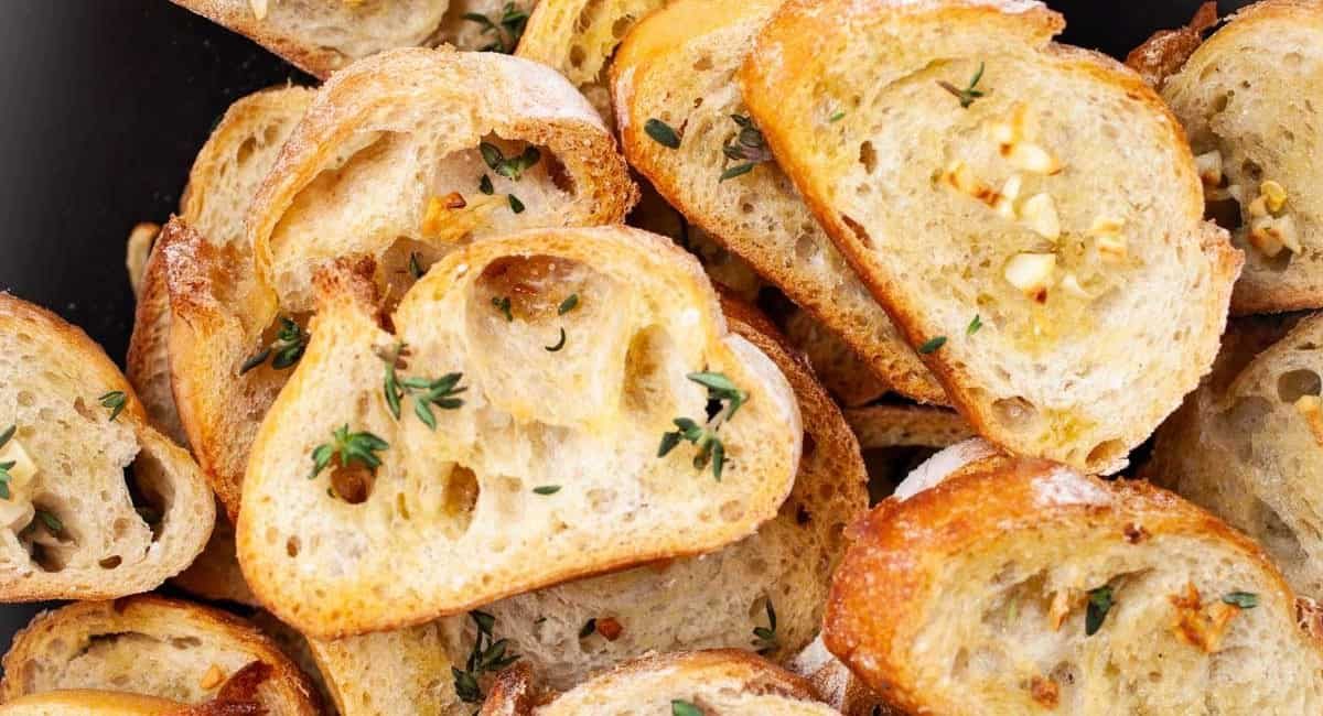 Up close image of garlic crostini with olive oil.