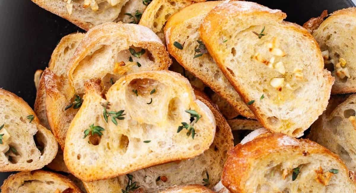 Up close image of garlic crostini with olive oil.