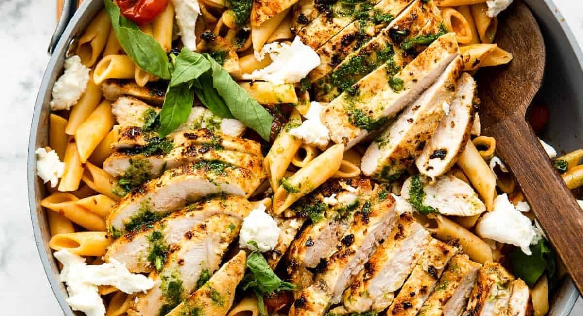 Overhead image of tomato basil pasta with chicken.